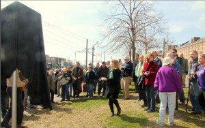 Labor history supporters gather before the unveiling of the monument
