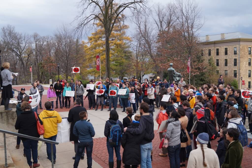 TAA members gathered in front of Bascom Hill, protesting the new proposal to restructure Graduate Assistant pay at UW-Madison. Photo credit to Cullen Vens, TAA Stewards' Council Co-Chair and Graduate student in Botany at UW-Madison.